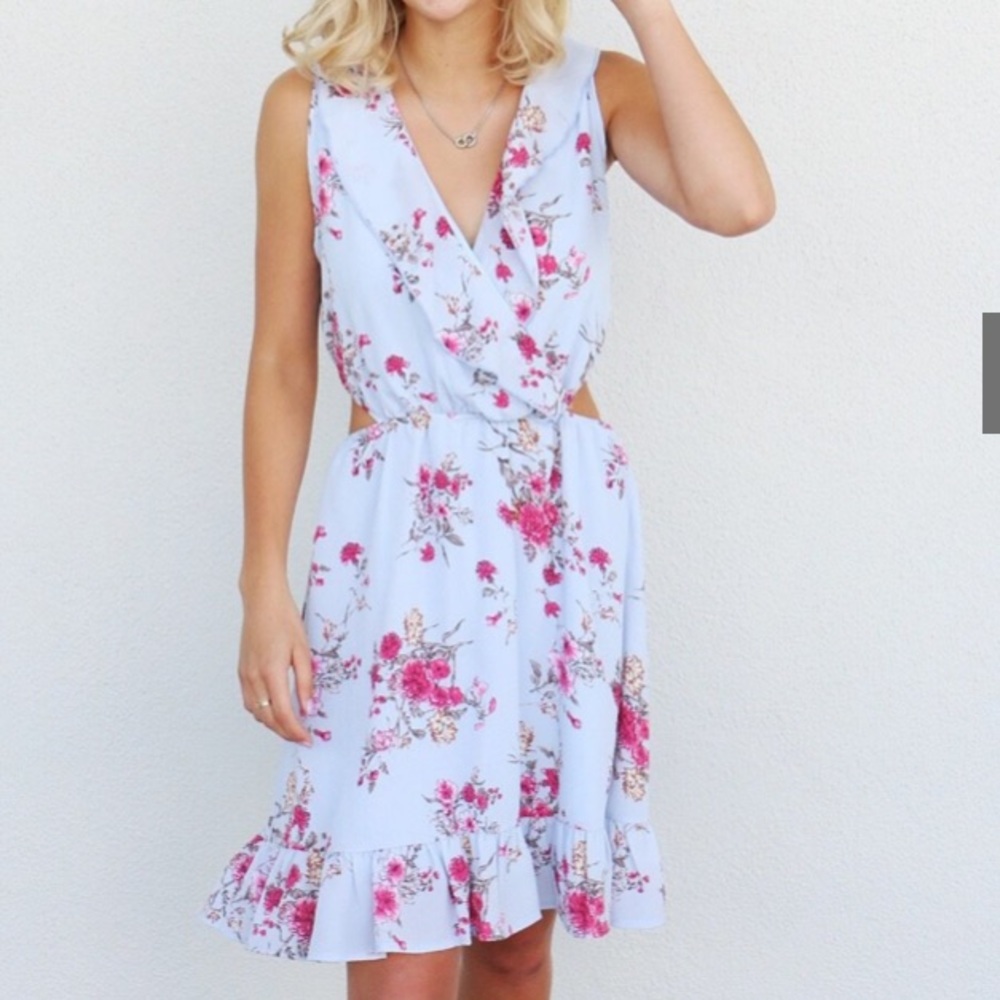 Flirty dress with cut outs on side